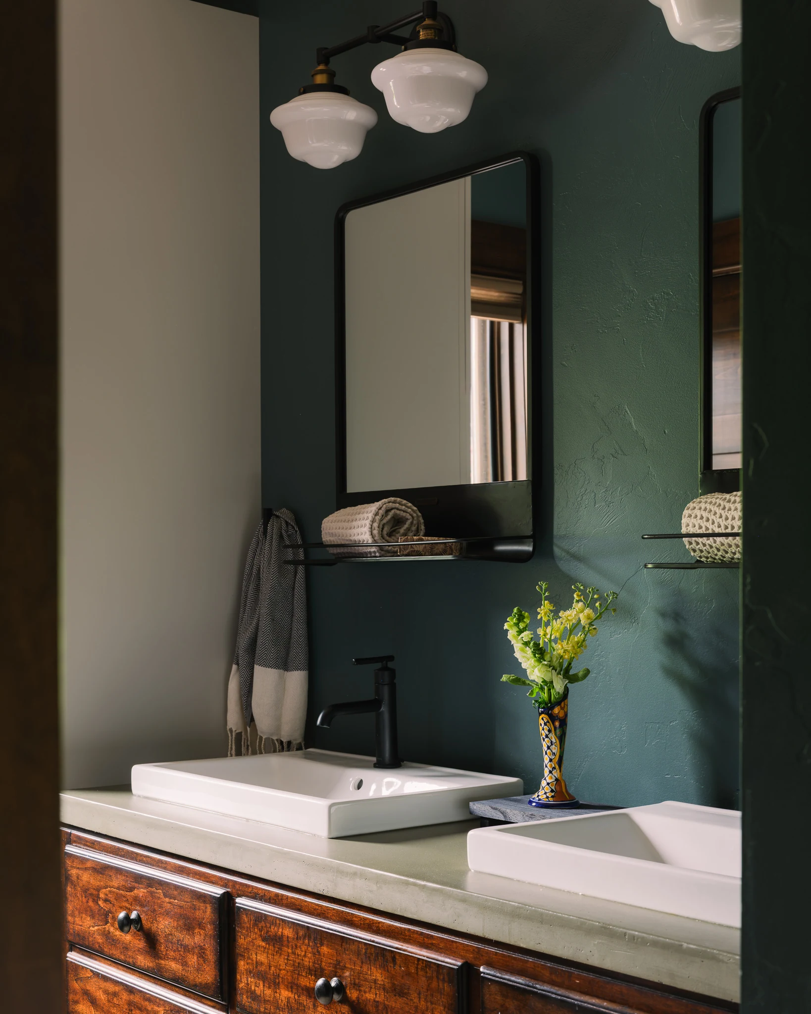 Bathroom with vessel sinks and dark teal walls — interior design photography Livingston Montana, Bear Canyon Ranch